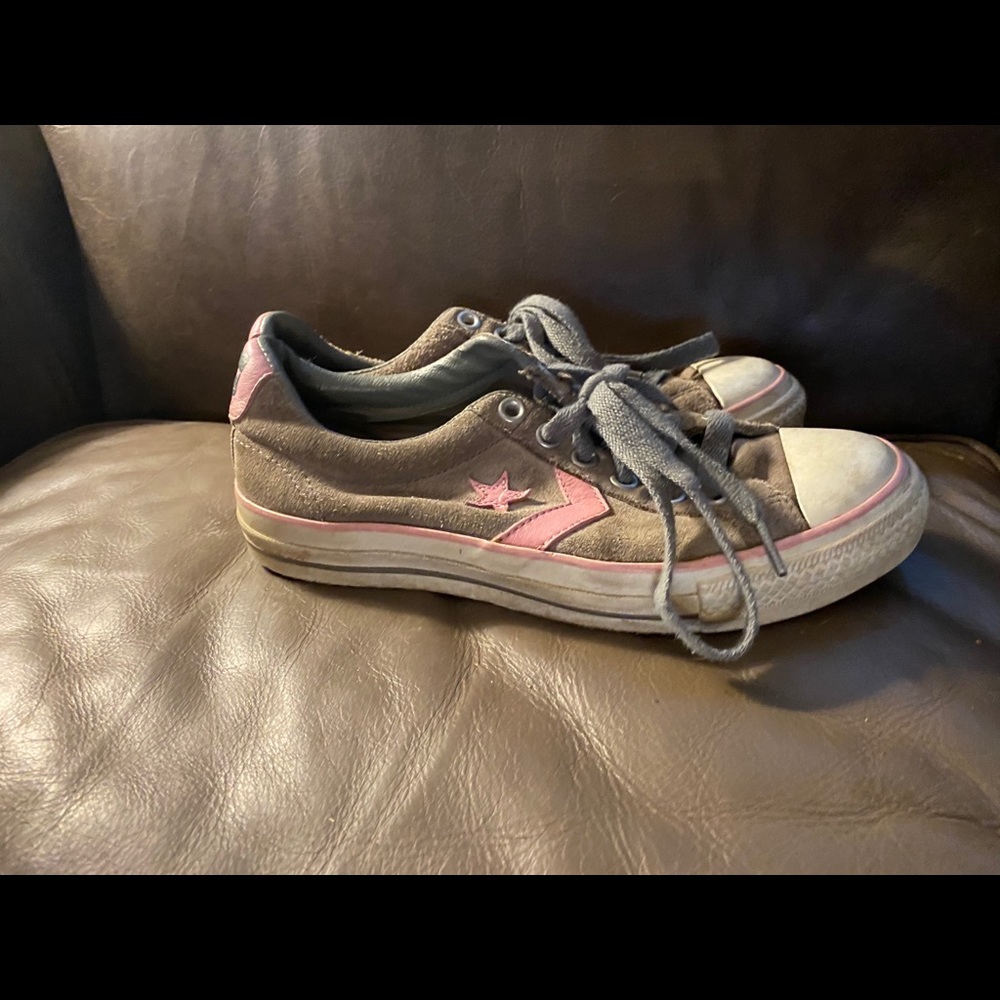 Gray and pink suede converse one star.